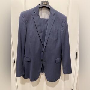 Brooks Brothers navy men’s suit. Jacket is 42L and pants are 34L/32.